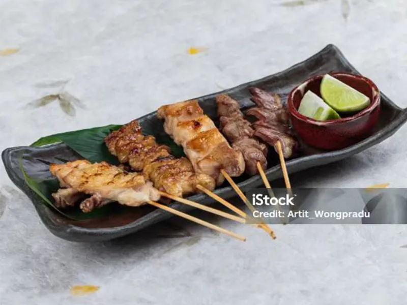 Juicy charcoal grilled chicken skewers served with fresh lime at Sushi Feast AYCE, a Japanese Restaurant in Ocala